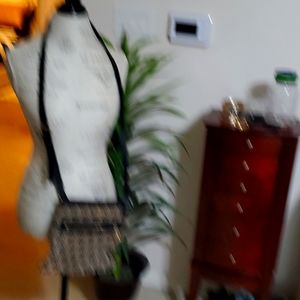 Michael KORS black/tan crossbody size M $38. Strap has a little thread showing.